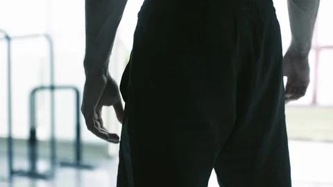 Man doing stretching exercises at the gym Stock Footage 127437225