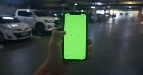 Man doing swipe up gesture on green screen mobile.unrecognizable guy hold green Stock Footage 249948274