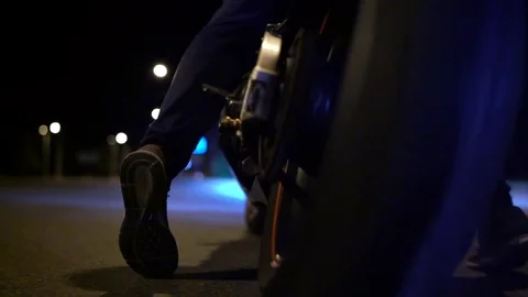 Man doing a tire burnout on motorcycle on the city road at night. Slow motion Video stock 78992260