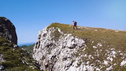 Man doing trekking in the mountains, walking to the top, Alta Badia mountains Stock-Footage 97563361