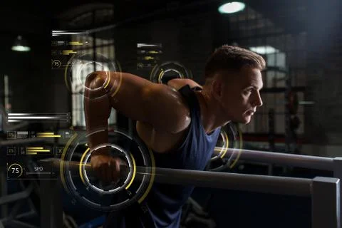 Man doing triceps dip on parallel bars in gym Stock Photos