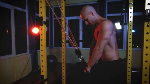 Man doing triceps workout with exercise bands in the gym Stock Footage 154794139