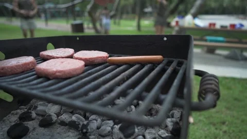 A man doing a trick on a grill Stock Footage 155454271