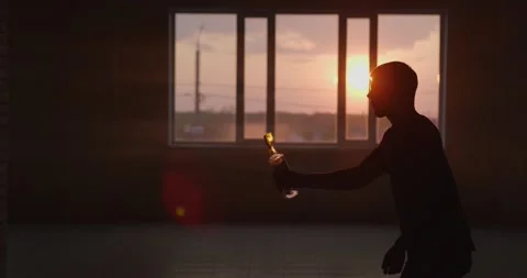 Man doing trick spraying vodka flame from bottle. Slow motion. Video stock 154364272