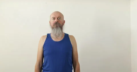 Man doing upper neck exercise, pulling up shoulders Stock Footage 236721370