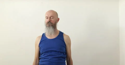 Man doing upper neck exercise, circling shoulders Stock Footage 236721793