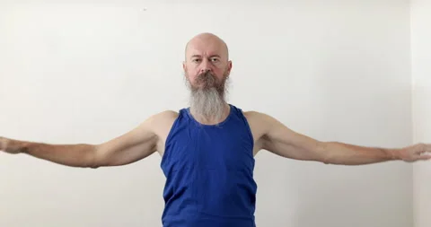 Man doing upper neck exercise, circling shoulders Stock Footage 236778086
