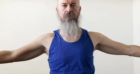 Man doing upper neck exercise, circling shoulders Stock Footage 236781241