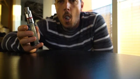 Man doing vape rings with e cigarette Stock Footage 101094820