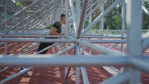 Man doing vertical push-ups in the park Stock Footage 100034600