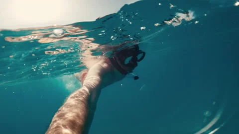 Man doing a video Selfie during swim in the ocean Stock Footage 197071344