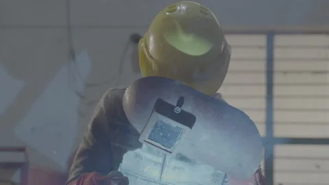 A man doing welding work in metal factory Stock Footage 237303321