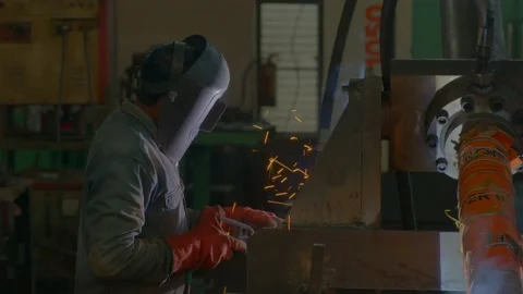 Man doing welding work in metal factory india Stock Footage 237304590