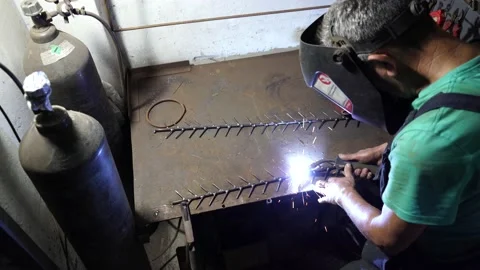 Man doing welding work. Welder welding a metal. Vídeos de archivo 159744606