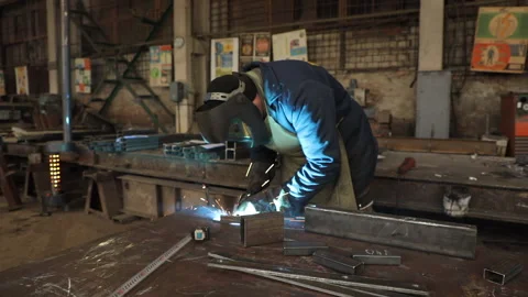 Man doing welding work. Welder welding a metal. Stock Footage 236170600