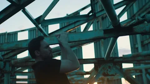 Man doing workout on the roof of a skyscraper Stock Footage 131400532