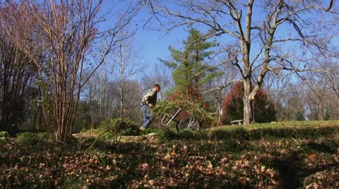 Man doing yard work Stock Footage 33370024