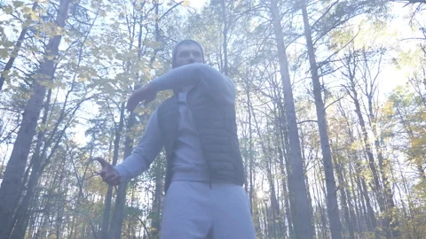 Man doing yoga and calisthenics in nature Video stock 264682453