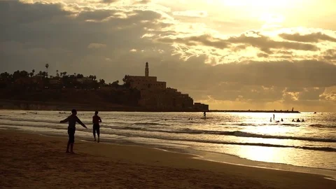 Man doing yoga on a  beach Stock Footage 82704056