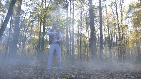 Man Doing Yoga Calisthenics in Forest Outdoors Stock Footage 264680087