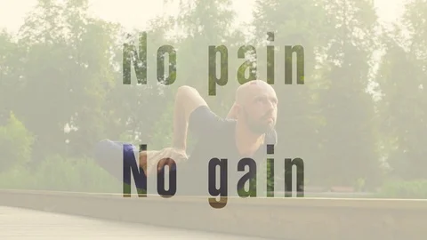 A man doing yoga exercises in the park Stock Footage