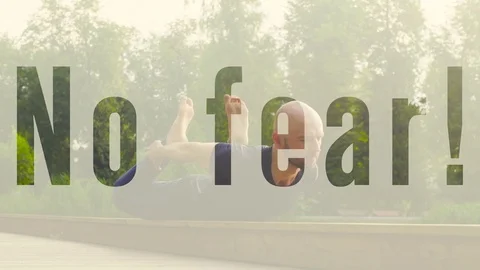 A man doing yoga exercises in the park Stock Footage