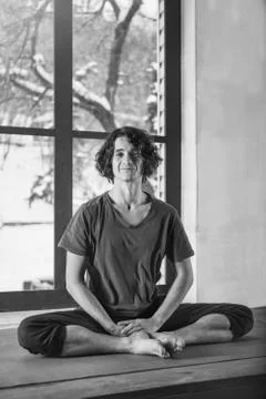 Man doing yoga exercises. Stock Photos