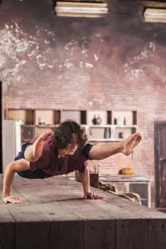 Man doing yoga exercises. Stock Photos