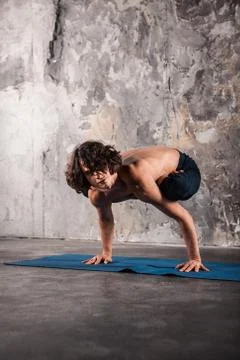 Man doing yoga exercises. Stock Photos