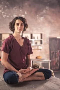 Man doing yoga exercises. Practicing yoga Stock Photos