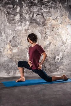 Man doing yoga exercises. Practicing yoga Stock Photos