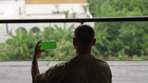 Man doing yoga with green screen on mobile, happy and rejoicing Stock Footage 268360882