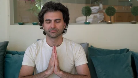 Man Doing Yoga with Hands Together Stock Footage 99480486