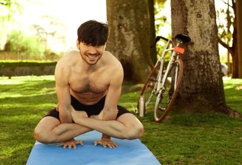Man doing yoga Stock Photos