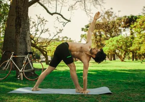 Man doing yoga Stock Photos
