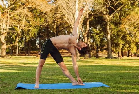 Man doing yoga Stock Photos