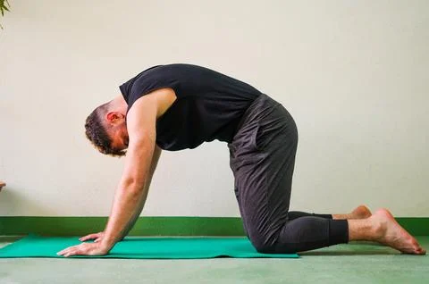 Man doing yoga Stock Photos
