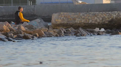 Man doing yoga at sunset Stock Footage 68703230