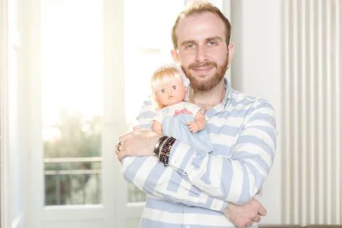 Man with a Doll Stock Photos