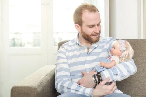 Man with a Doll Stock Photos