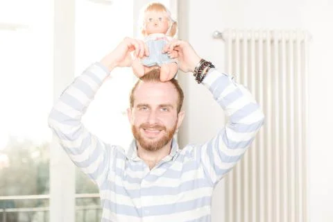 Man with a Doll Stock Photos