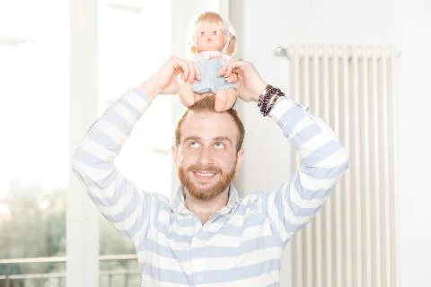 Man with a Doll Stock Photos