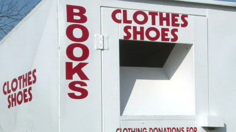 Man Donating items to Bin Stock Footage