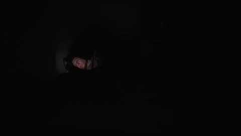 Man doomscrolling at night in dark bedroom, loneliness, insomnia and emotional Stock-Footage 321064352