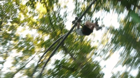 Man down on the bungee in the Park outdoor activities Video stock 68209557