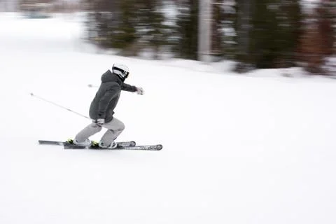 Man down the mountain on skis Stock Photos