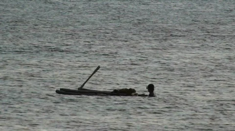 Man drags raft Stock Footage 637663