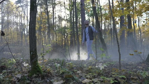 Man in Dramatic Mountain Cave Natural Setting Stock Footage 264676695
