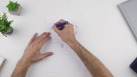 Man draw, sketch an object to be crafted Stock Footage 138065606
