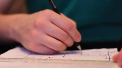 Man drawing and checking scheme Stock Footage 35121537